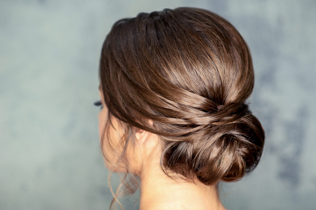 Brunette hair women with a chignon hairstyle